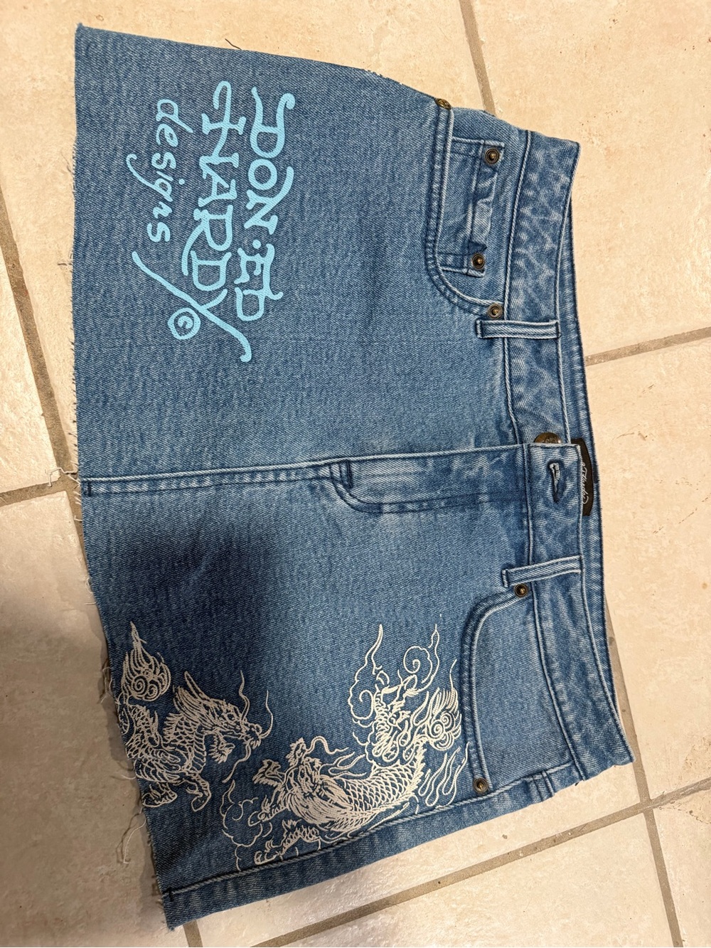 Ed Hardy Blue Denim Mini Skirt with Light Blue Logo and White Dragon Embroidery